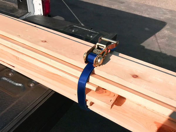 Endless loop tie-down holding lumber