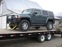 Jeep secured for transport using factory tie-down points